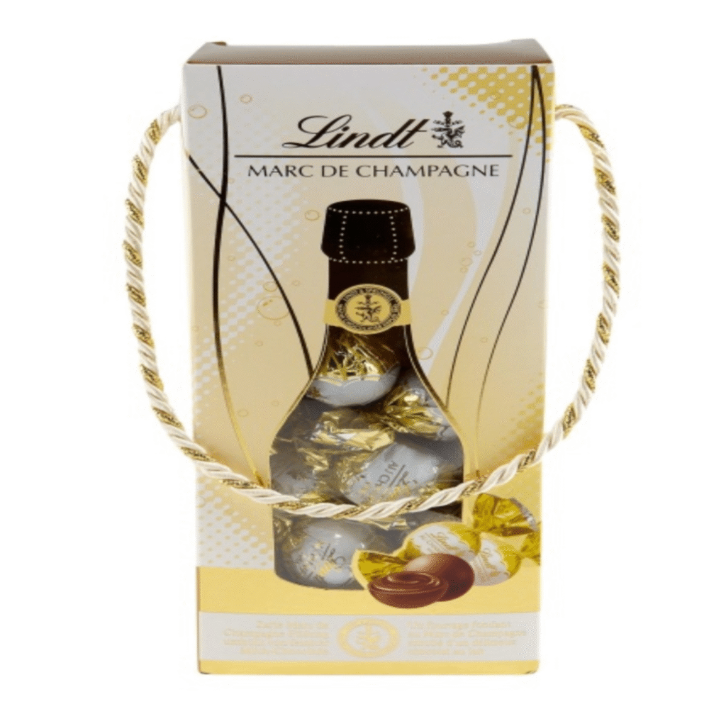 Опаковка Lindt Marc de Champagne коледна бонбониера 350 г – луксозни шоколадови бонбони с крем от шампанско, идеални за празници.